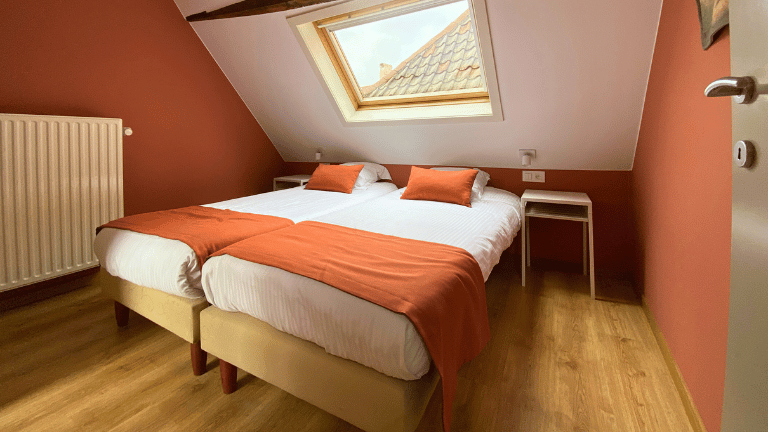 Bedroom in a city center six persons apartment in Bruges with air conditioning.